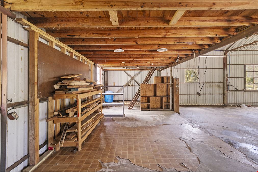 Unrestricted Versatile 1-Acre Commercial Property in Conroe –  Industrial Storage Shed & Carport & home