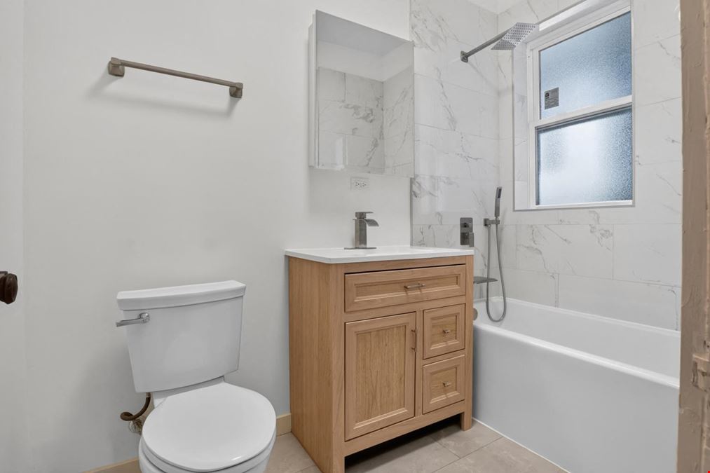 1528 E 74TH PL | 6 Unit Multifamily