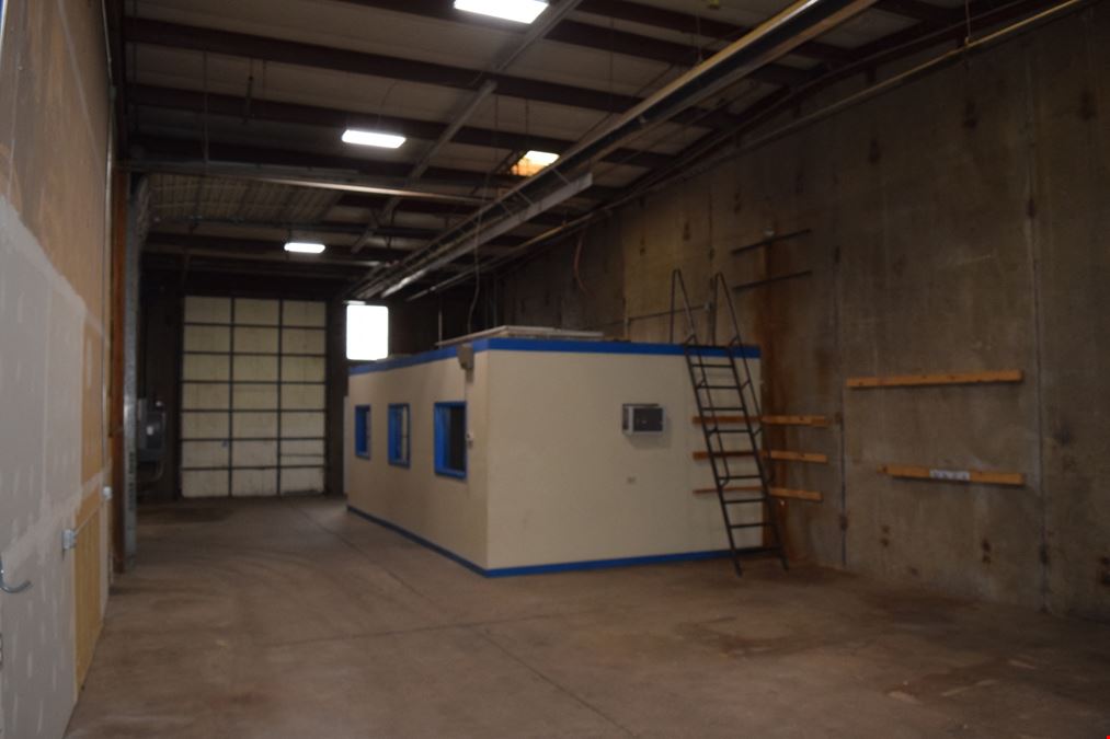 2,000 SF warehouse with dock high loading (drive in access potential)