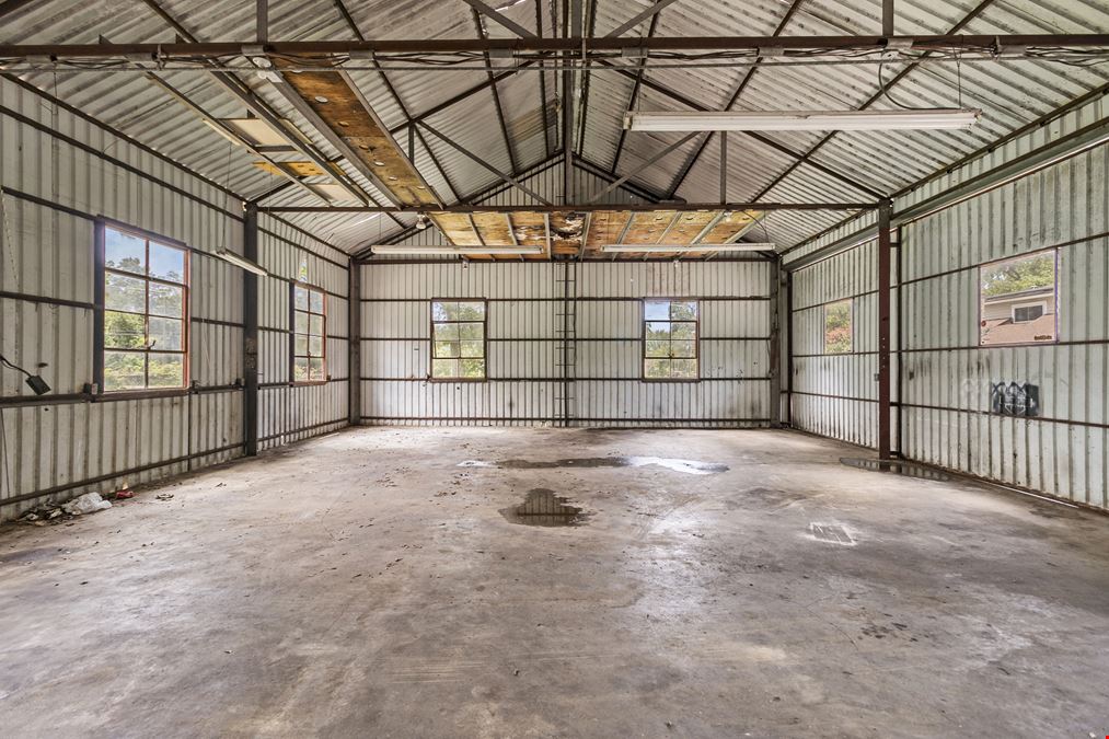 Unrestricted Versatile 1-Acre Commercial Property in Conroe –  Industrial Storage Shed & Carport & home