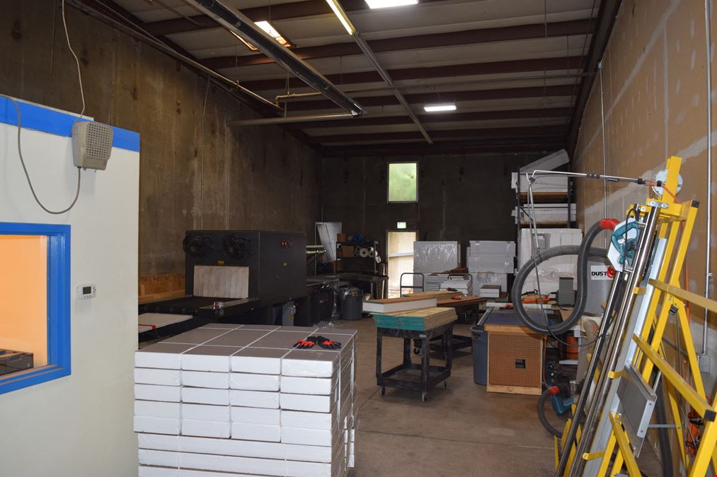 2,000 SF warehouse with dock high loading (drive in access potential)