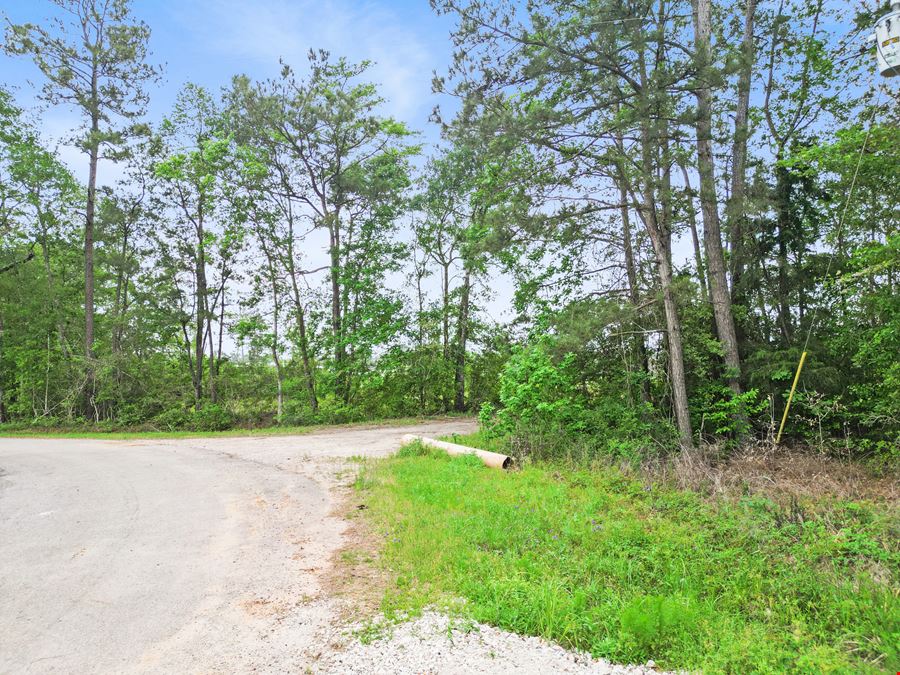 Expansive 23-Acre Tract on High-Traffic Hwy 105 – Prime Development Opportunity with Seller Financing Available