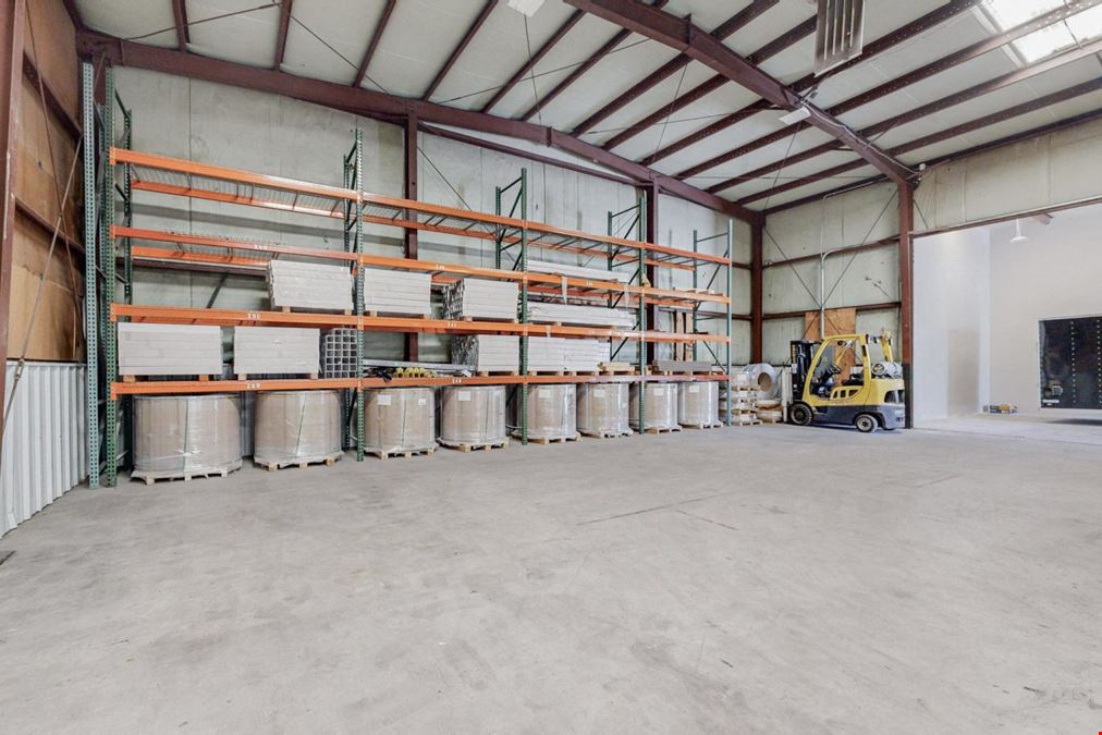 Newly Updated Clearspan Warehouse with Gated & Paved Yard near Big I