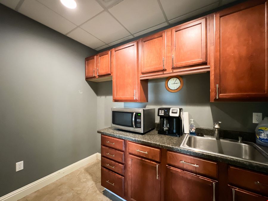 Office Warehouse w/ Rental Income Bordering Airport