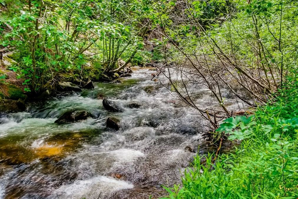 Water & Stone Cabins | 14-Keys | C-3 Zoning | Live Creek Frontage | 6.7 CAP