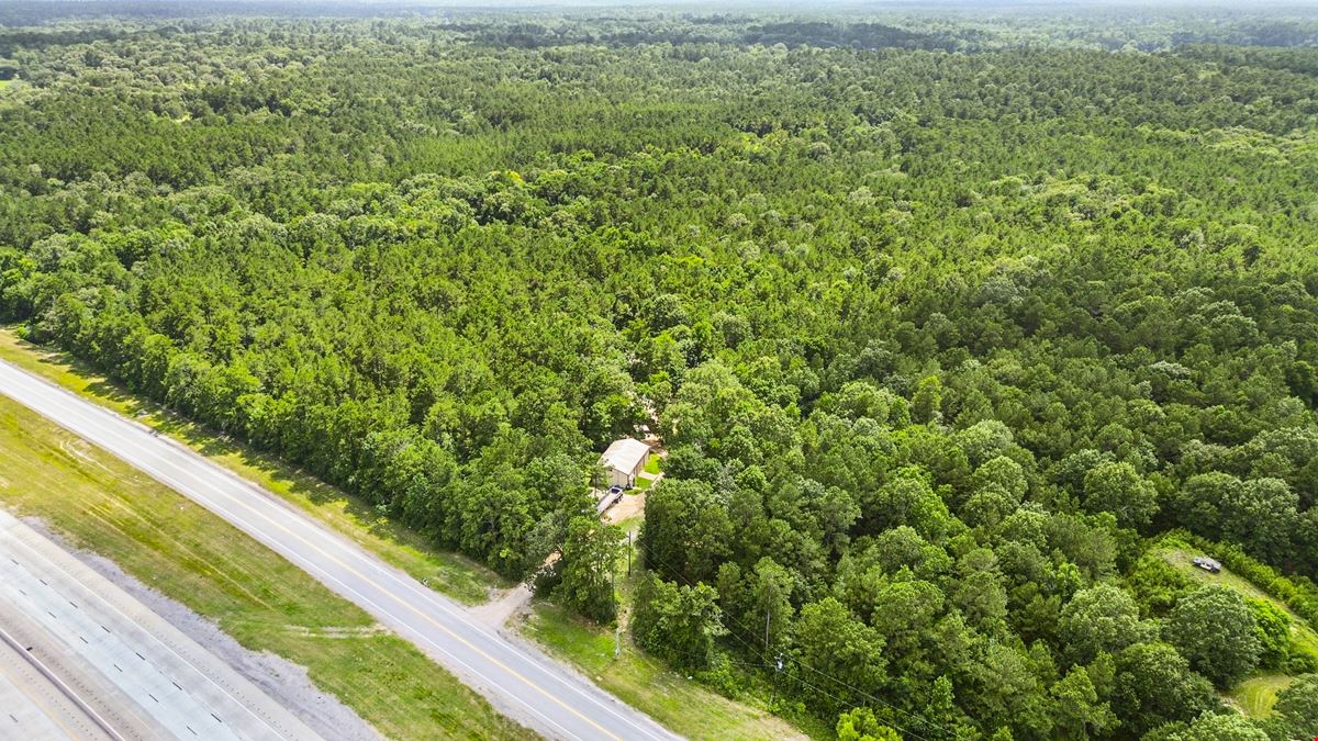 Prime Interstate-Frontage Commercial Tract – ±8.8 Acres with 3 Income Producing Building
