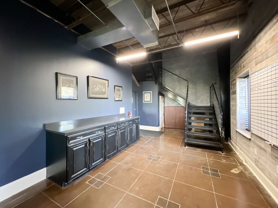 Office Warehouse w/ Rental Income Bordering Airport