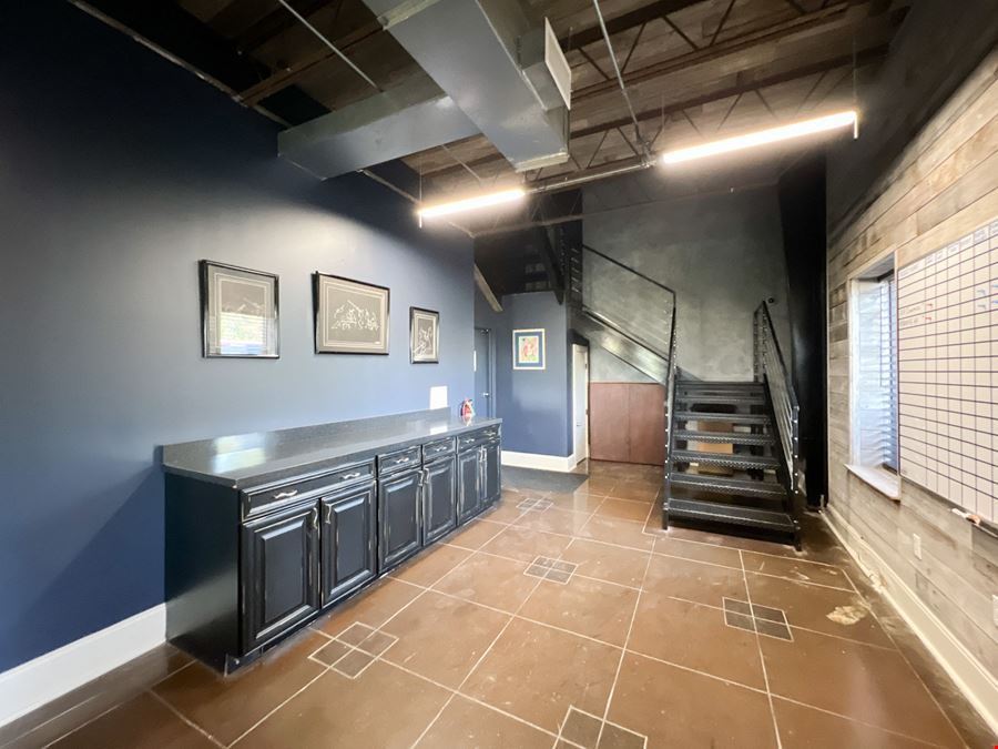 Office Warehouse w/ Rental Income Bordering Airport