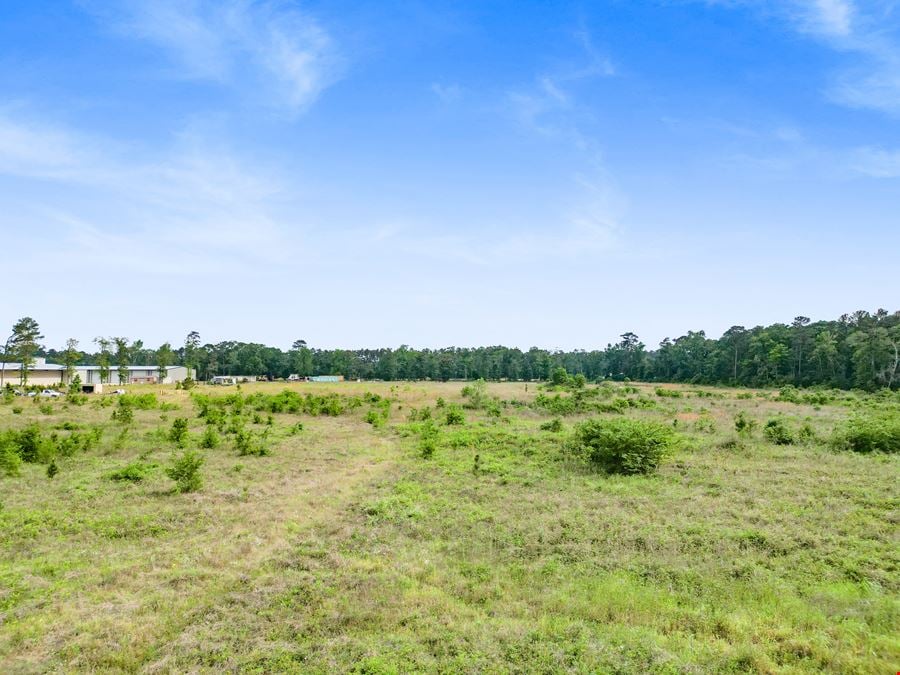 Expansive 23-Acre Tract on High-Traffic Hwy 105 – Prime Development Opportunity with Seller Financing Available