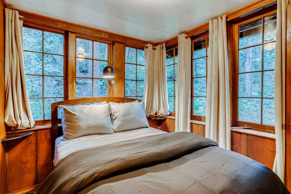 Water & Stone Cabins | 14-Keys | C-3 Zoning | Live Creek Frontage | 6.7 CAP