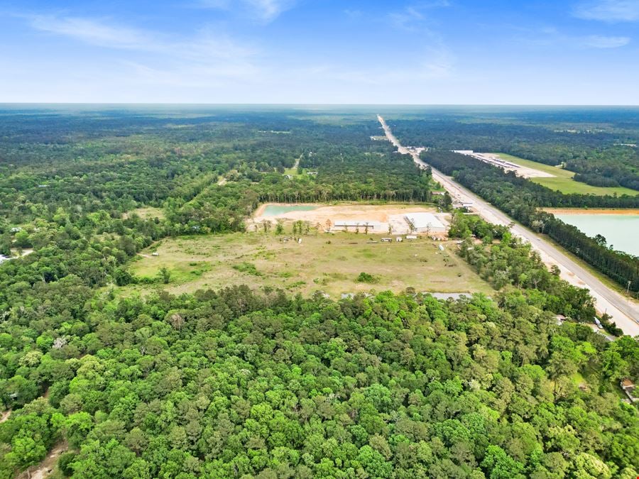 Expansive 23-Acre Tract on High-Traffic Hwy 105 – Prime Development Opportunity with Seller Financing Available
