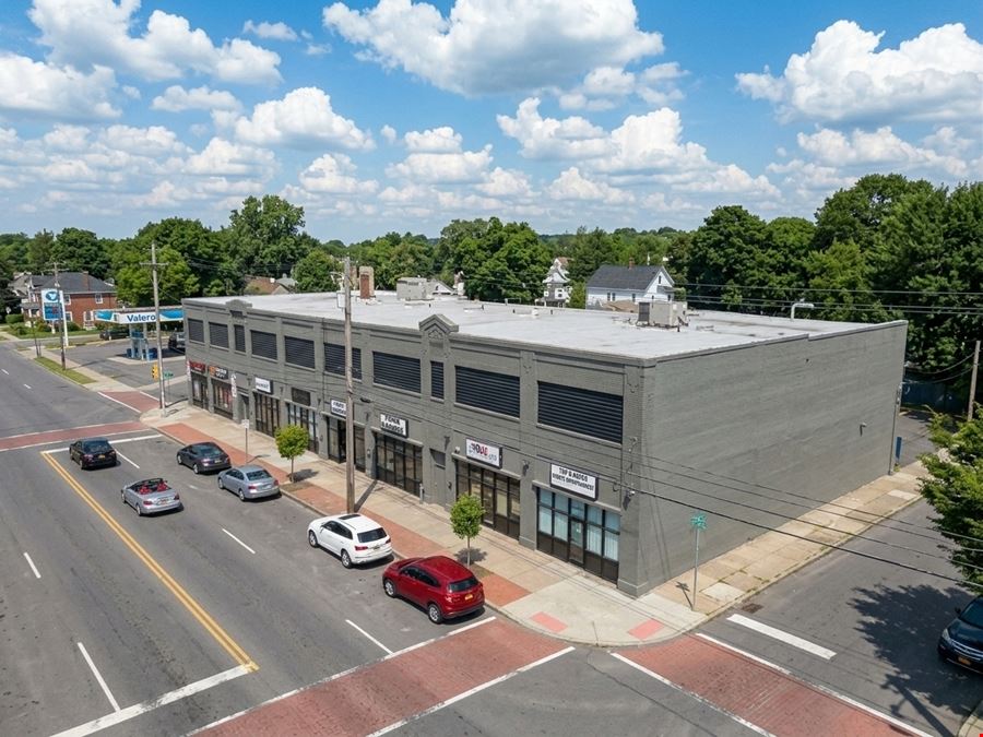 Syracuse Mixed-Use Corner Building – Retail Income + Residential Conversion