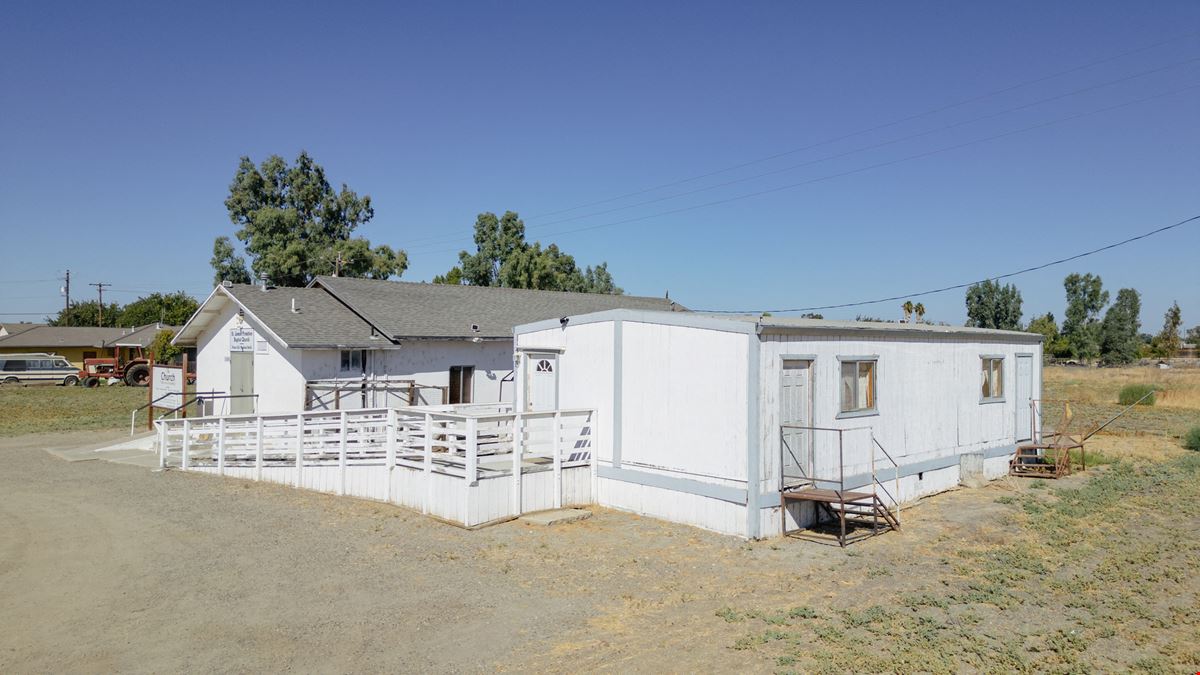 Church building with Modular home and 2 Sheds perfect for storage!