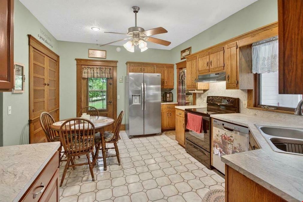 UPDATED RESIDENCE & 30X40 SHOP | ZONED BUSINESS ON 1.3 ACRES