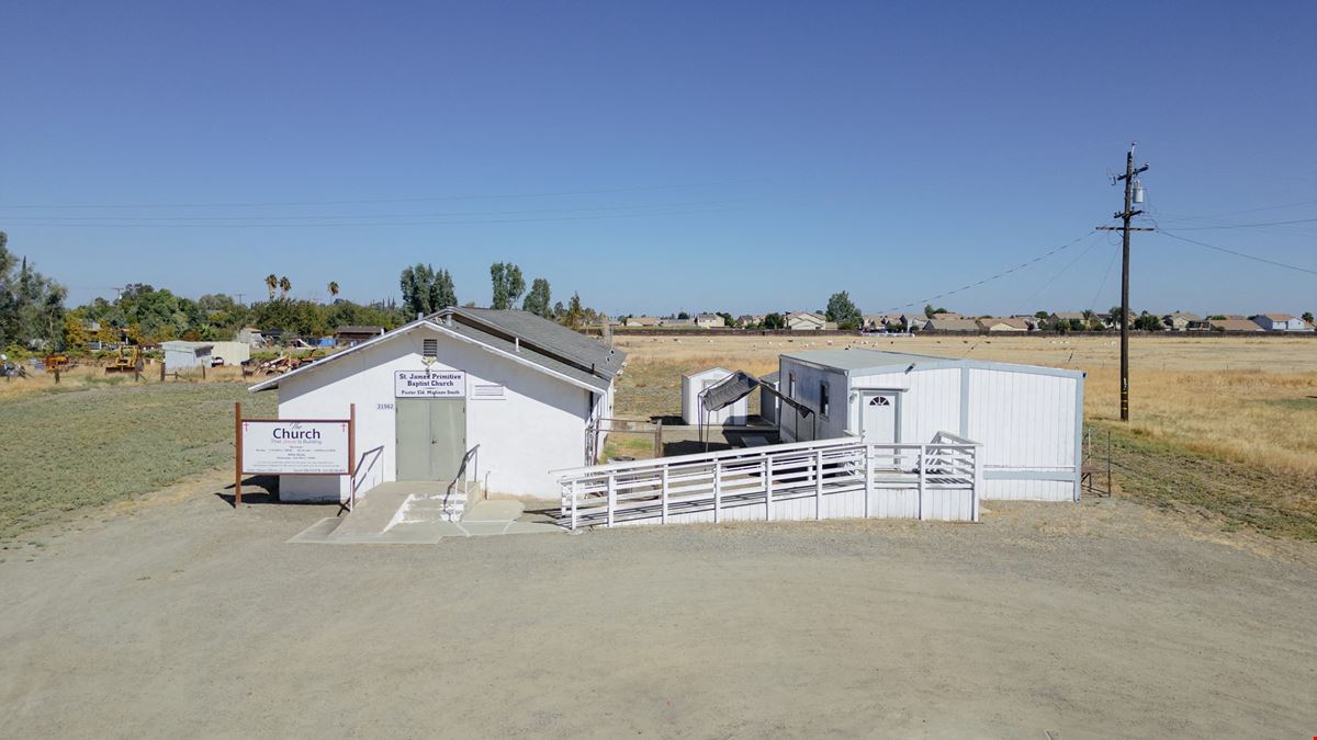 Church building with Modular home and 2 Sheds perfect for storage!