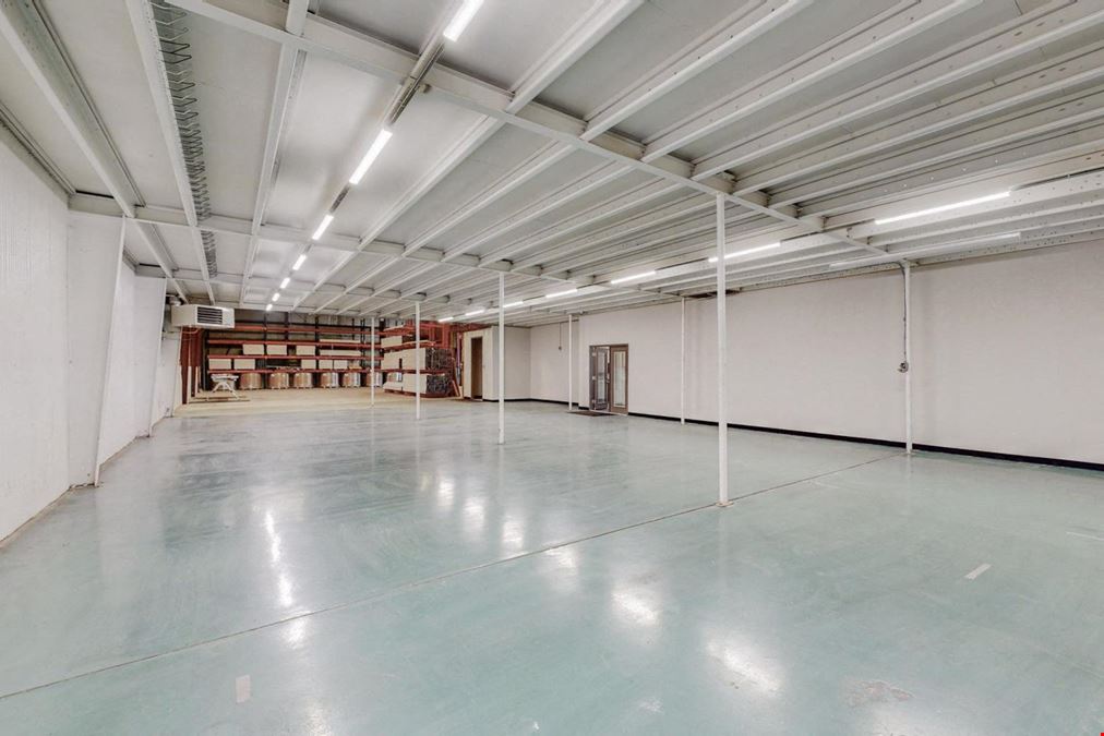 Newly Updated Clearspan Warehouse with Gated & Paved Yard near Big I