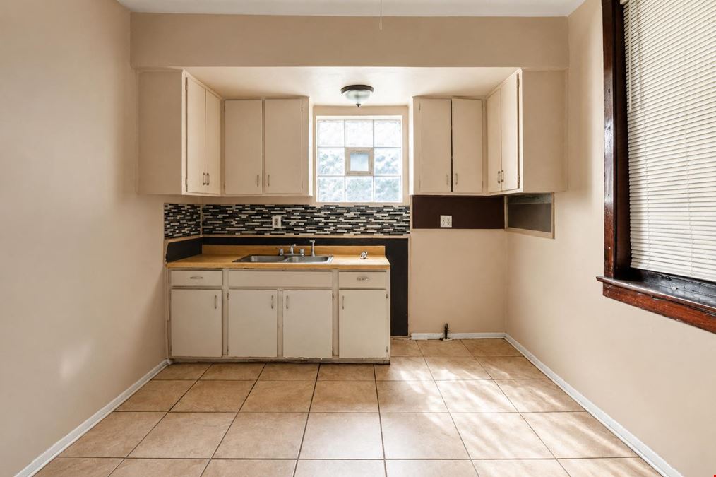 1528 E 74TH PL | 6 Unit Multifamily