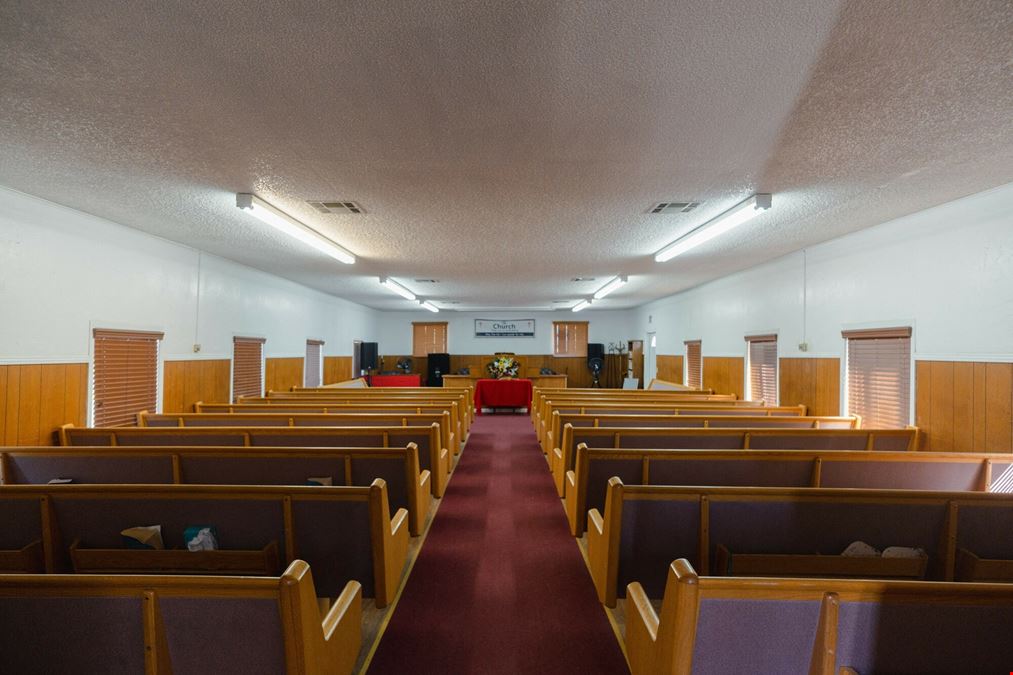 Church building with Modular home and 2 Sheds perfect for storage!