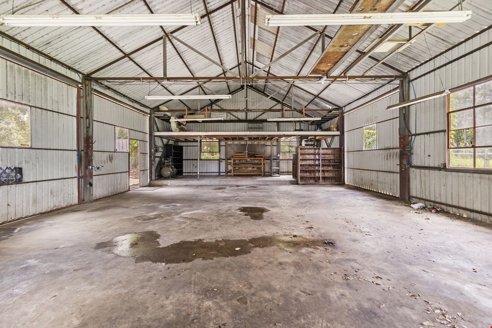 Unrestricted Versatile 1-Acre Commercial Property in Conroe –  Industrial Storage Shed & Carport & home