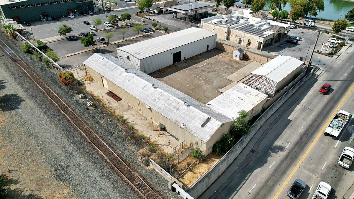 ±11,500 SF Of Clear Span Industrial Buildings + Fenced Lot