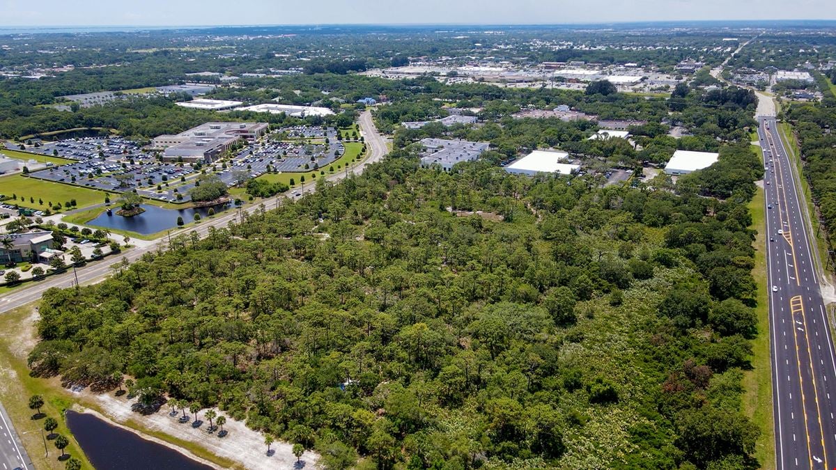 23±AC Development Site | Adjacent to Orlando-Melbourne Int'l Airport | Retail/Office/Hotel/Motel/Possible Multi-Family