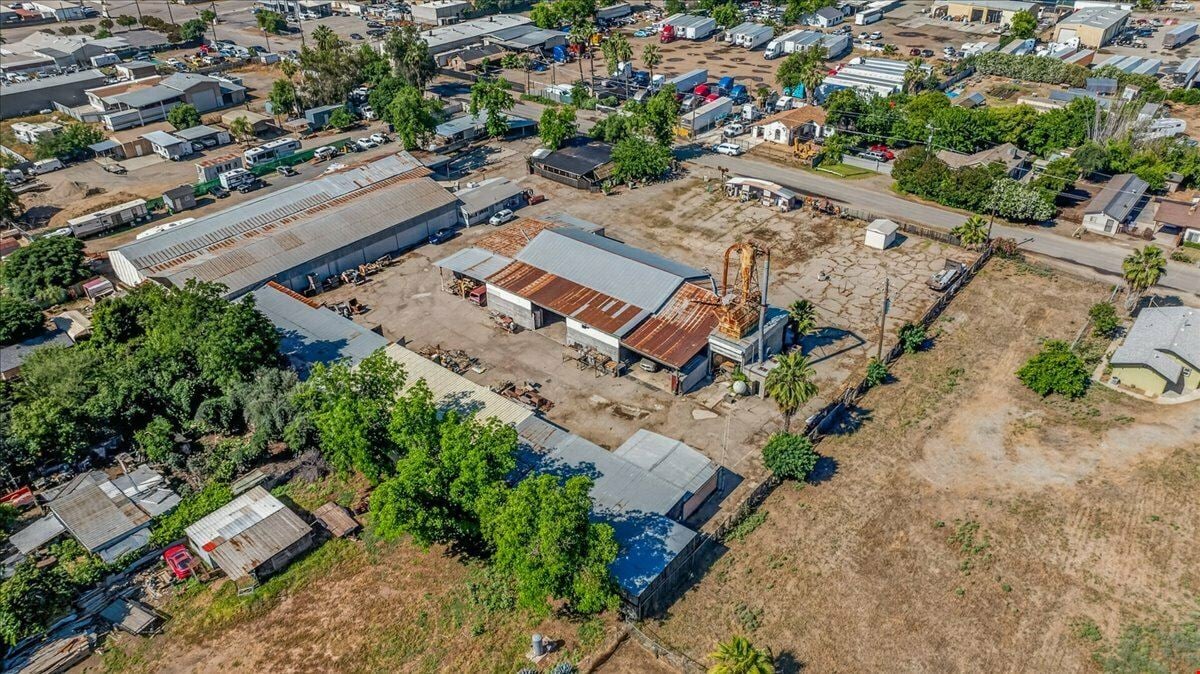 Open Industrial Buildings on 2.14 AC Fenced Land