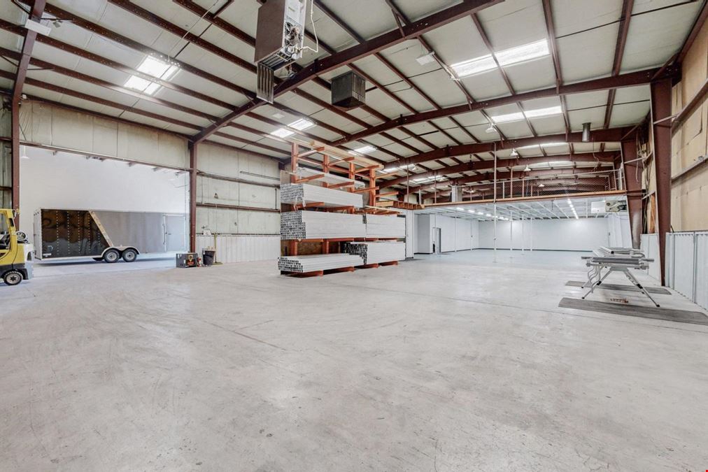 Newly Updated Clearspan Warehouse with Gated & Paved Yard near Big I