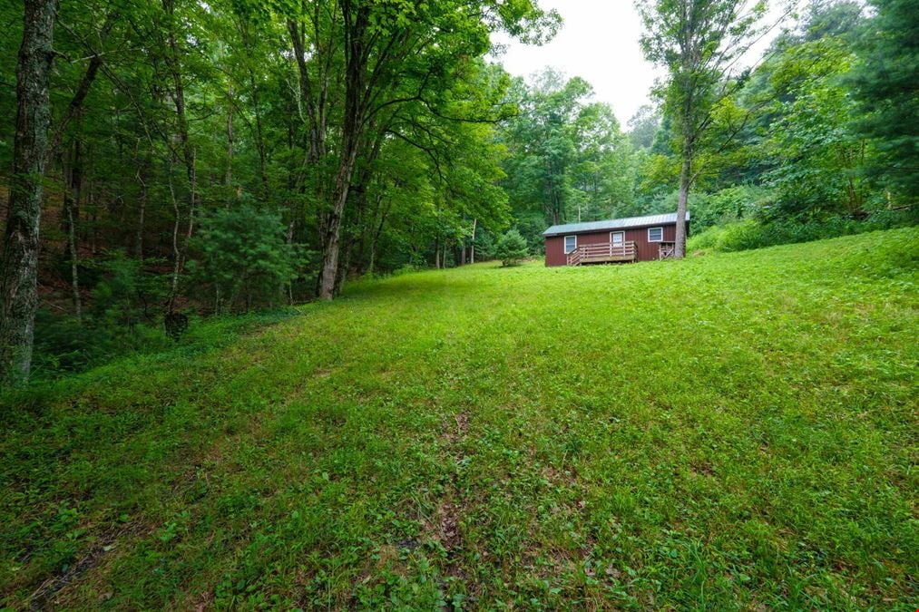 ADJOINING NATIONAL FOREST - 54.5 ACRE OFF-GRID MOUNTAIN RETREAT W/ CABIN