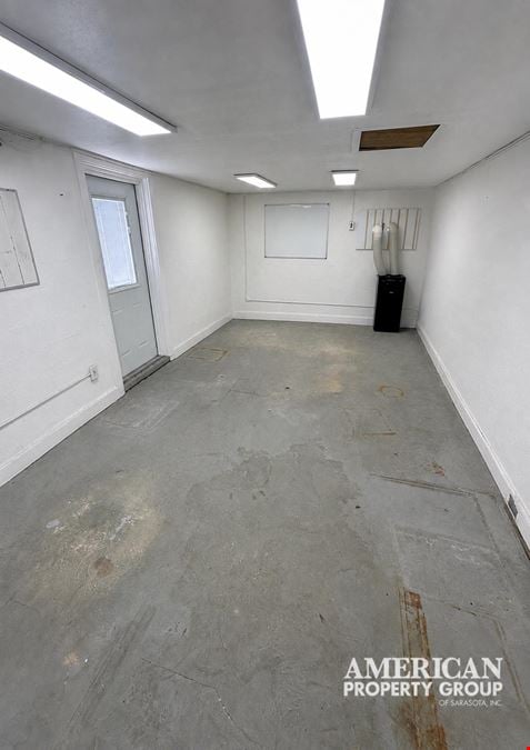Freestanding Commercial Building with Fenced Land in Downtown Englewood