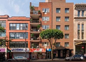 Prime Investment Opportunity: Fully Leased 10-Unit Building with Commercial Space