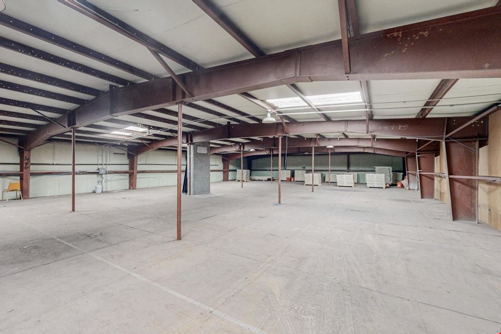 Newly Updated Clearspan Warehouse with Gated & Paved Yard near Big I