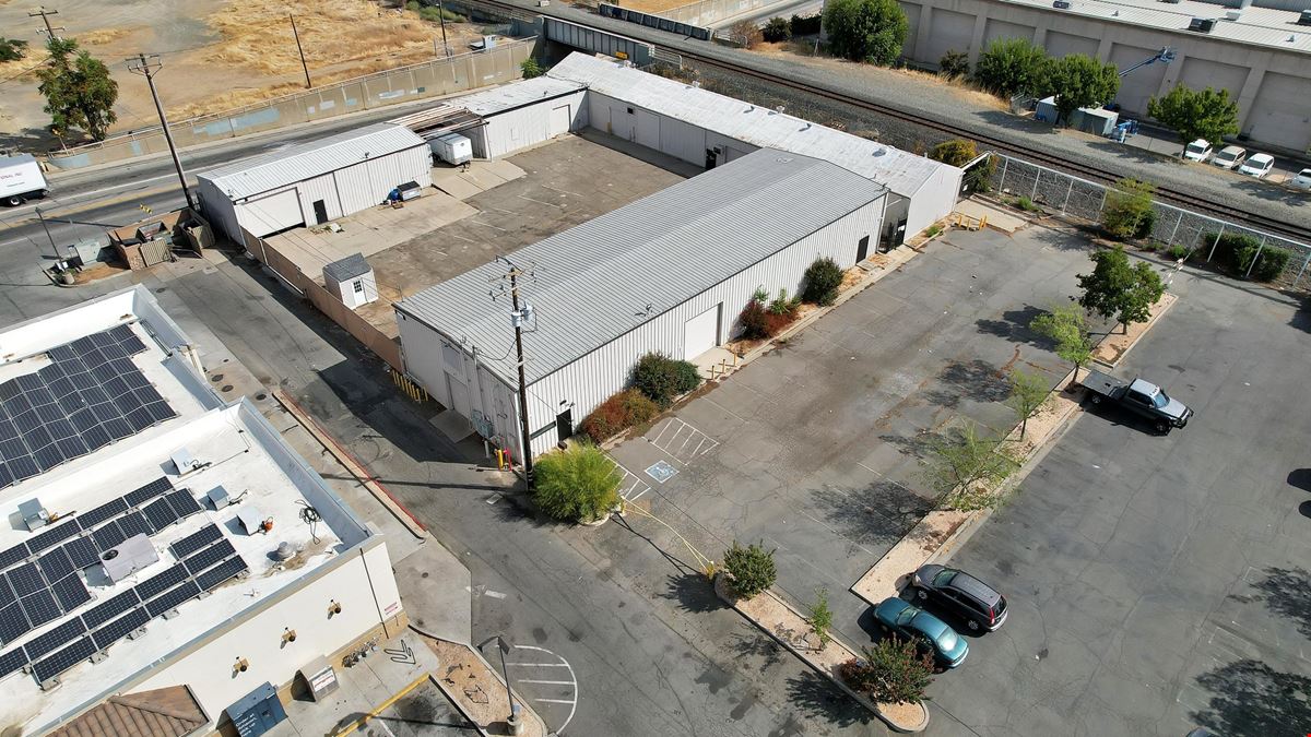 ±11,500 SF Of Clear Span Industrial Buildings + Fenced Lot