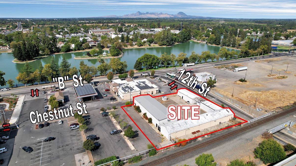 ±11,500 SF Of Clear Span Industrial Buildings + Fenced Lot