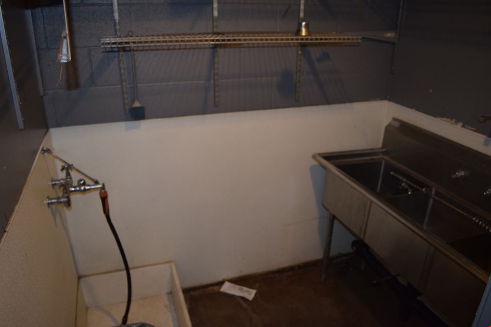 1,500 SF free-standing office/warehouse with small yard.
